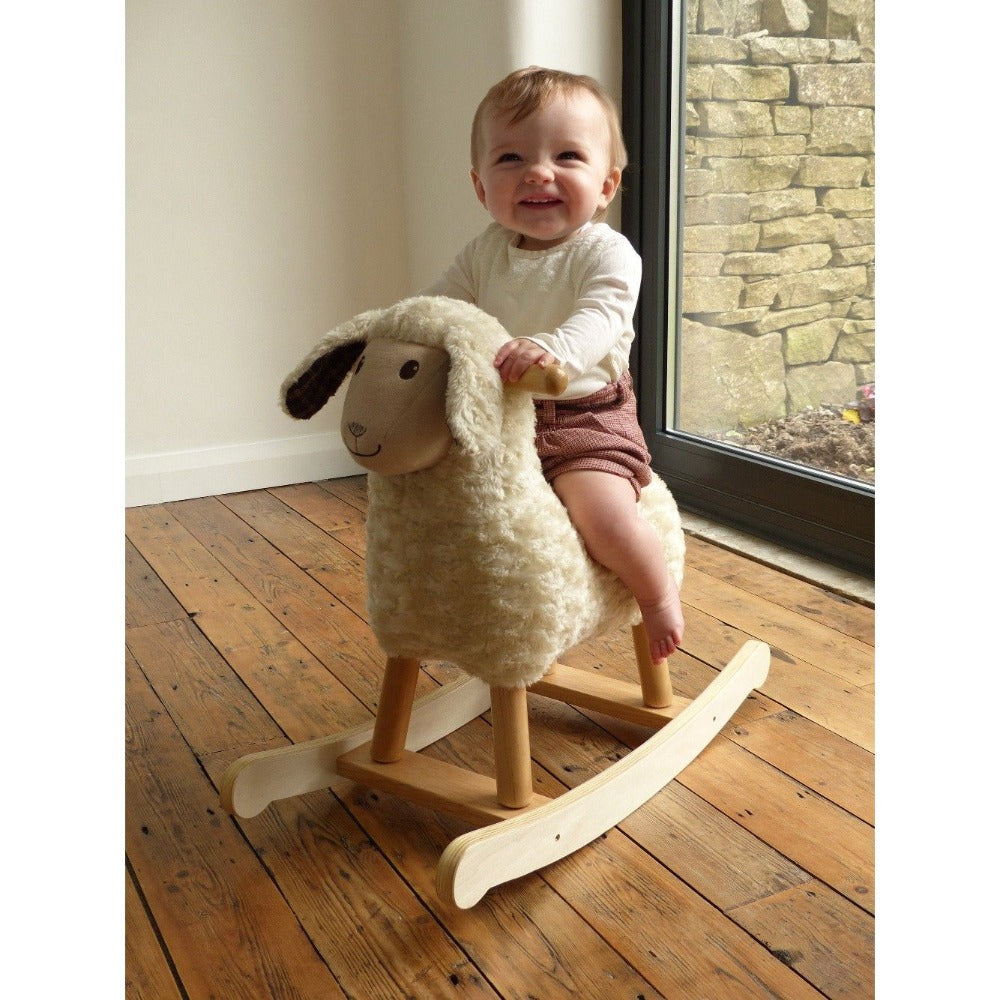little girl riding Lambert Rocking sheep, by Little Bird Told Me