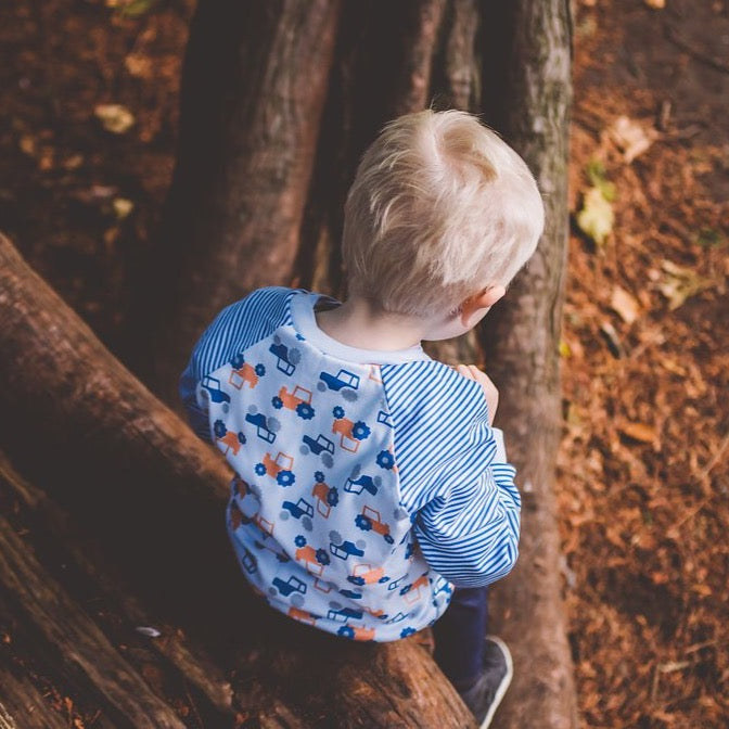 little boy wearing Tractor Sweatshirt from Toucan Blue | Cotswold Baby Co