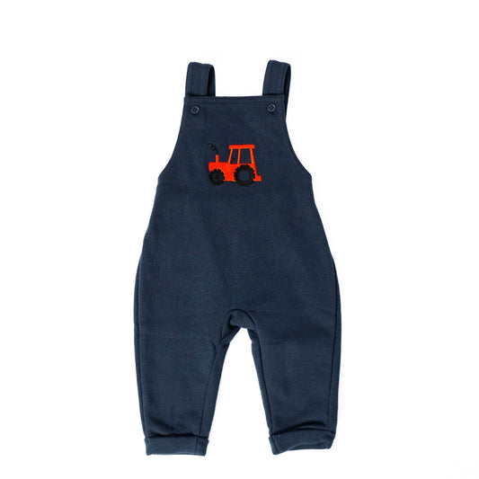 Navy blue overalls with a red tractor design on a white background