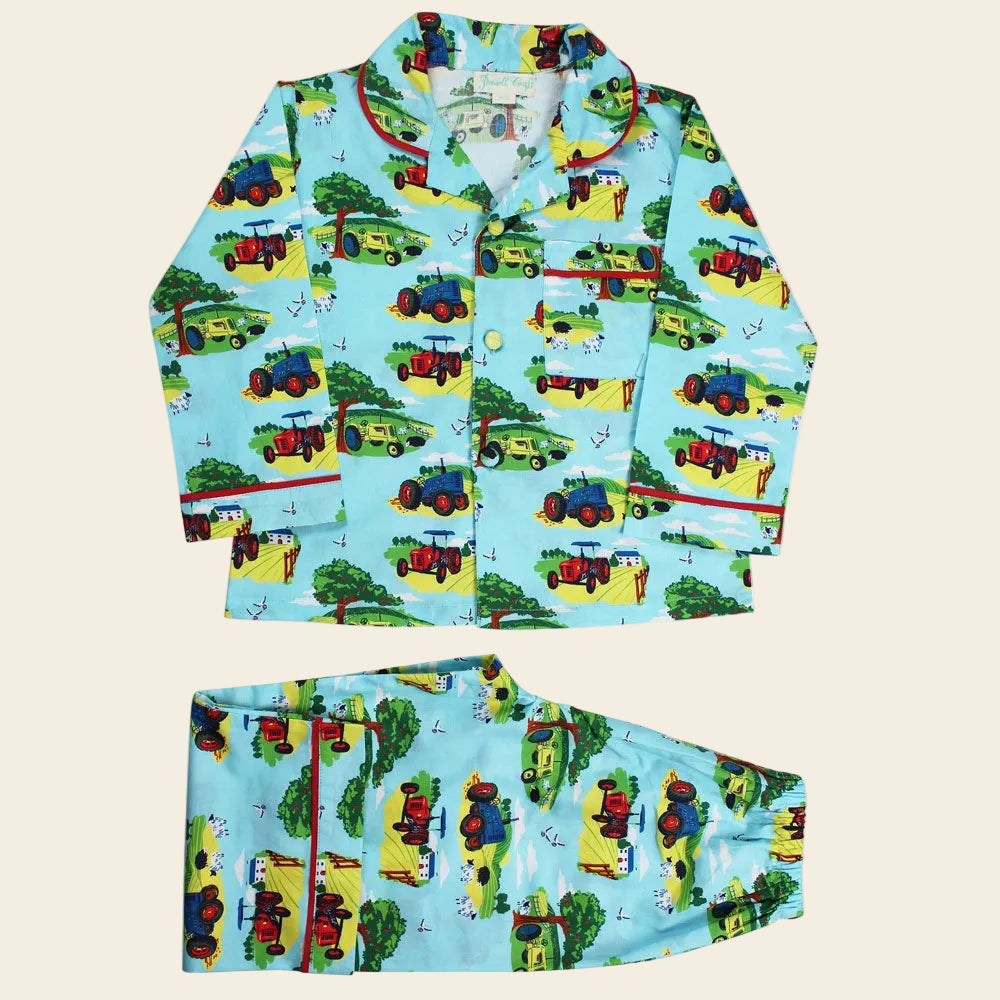 Children's pajama set with train pattern on a blue background