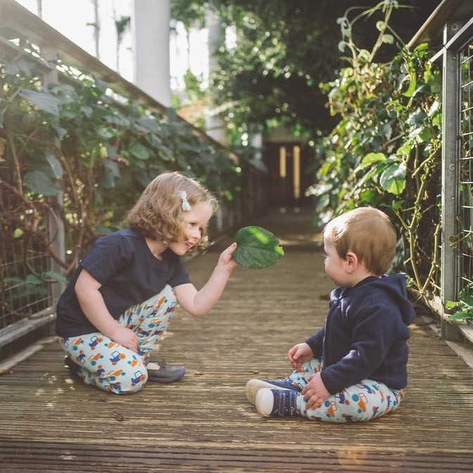 toddler wearing aqua cuffed tractor leggings | Cotswold Baby Co