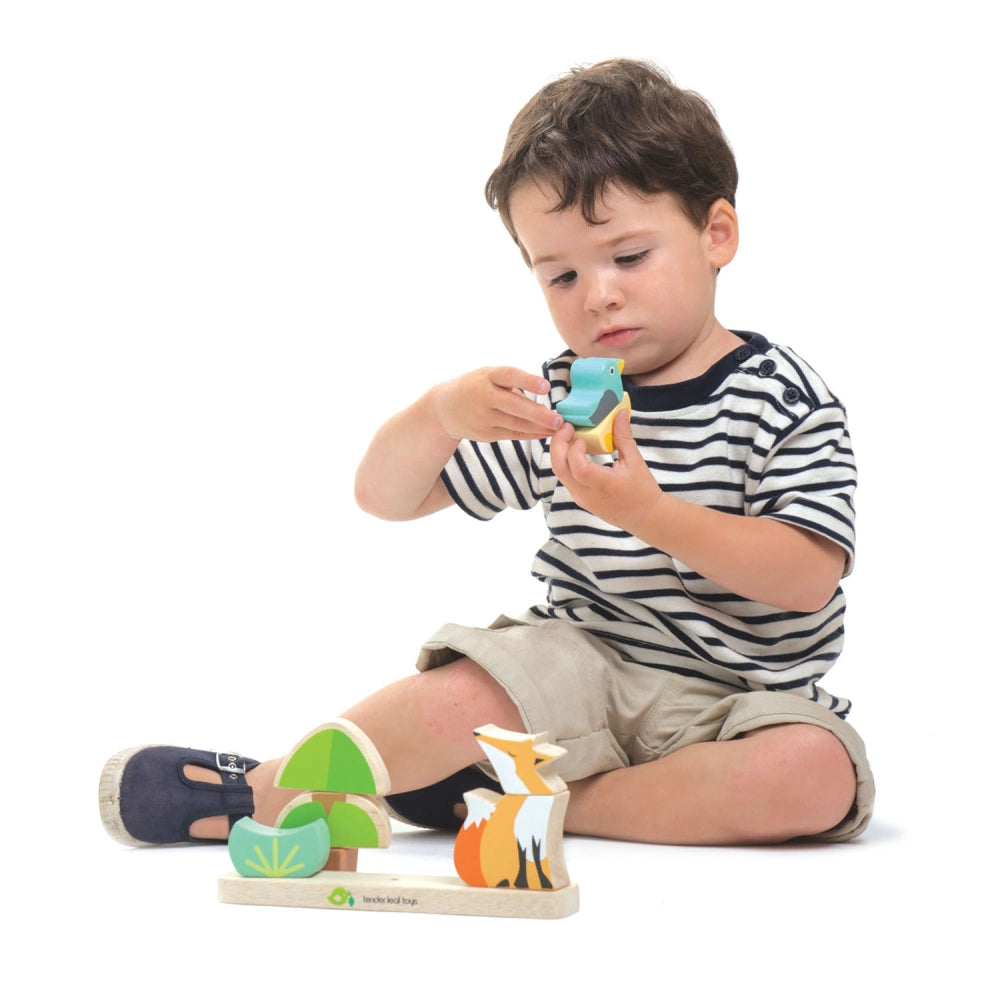 Boy playing with wooden toy 