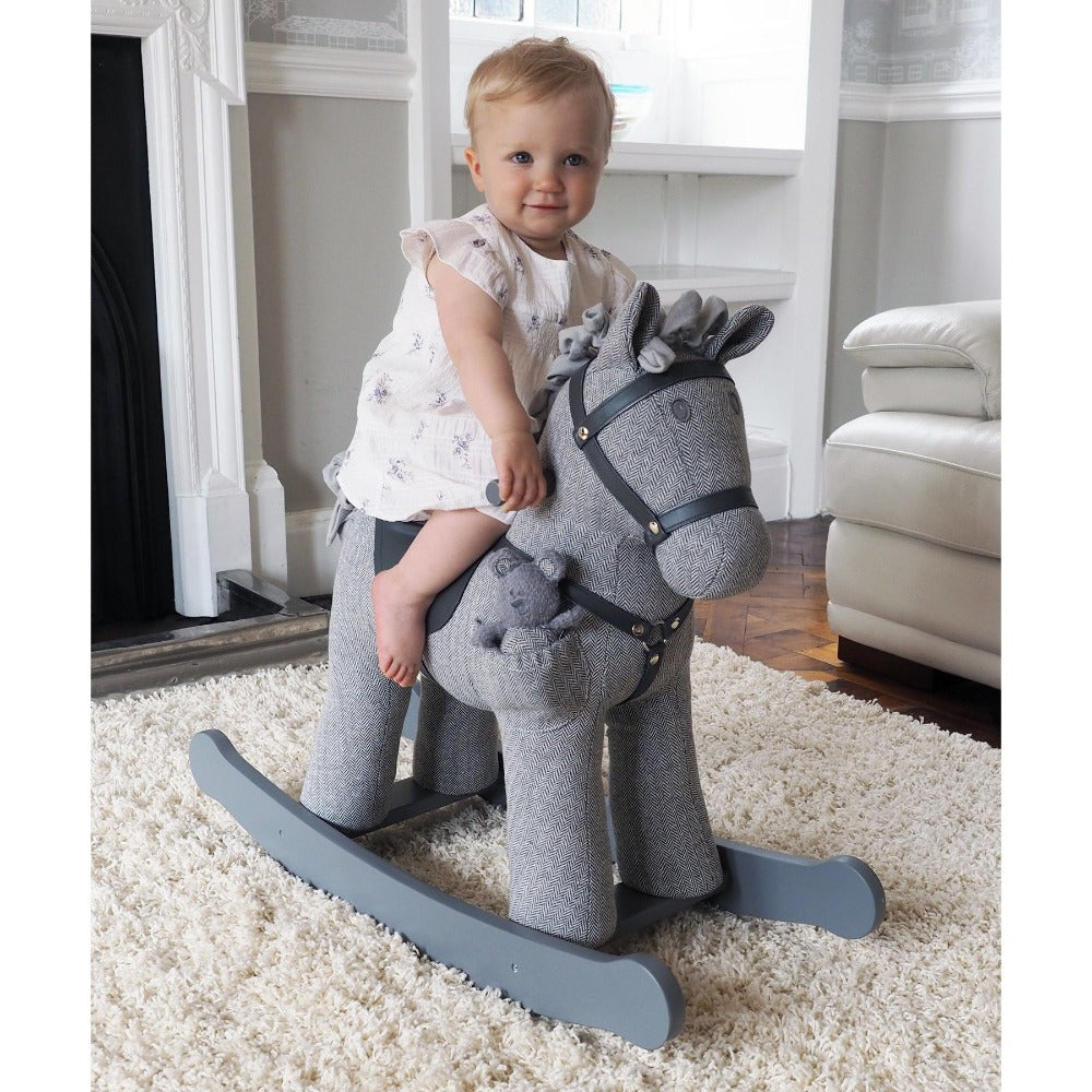 Little girl riding Stirling & Mac Rocking Horse