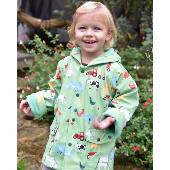 Little girl wearing Down on the Farm Raincoat by Powell Craft