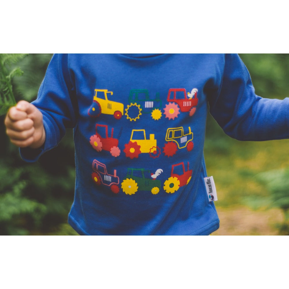 Little girl wearing Long Sleeved Tractor T-shirt by Toucan Blue | Cotswold Baby Co