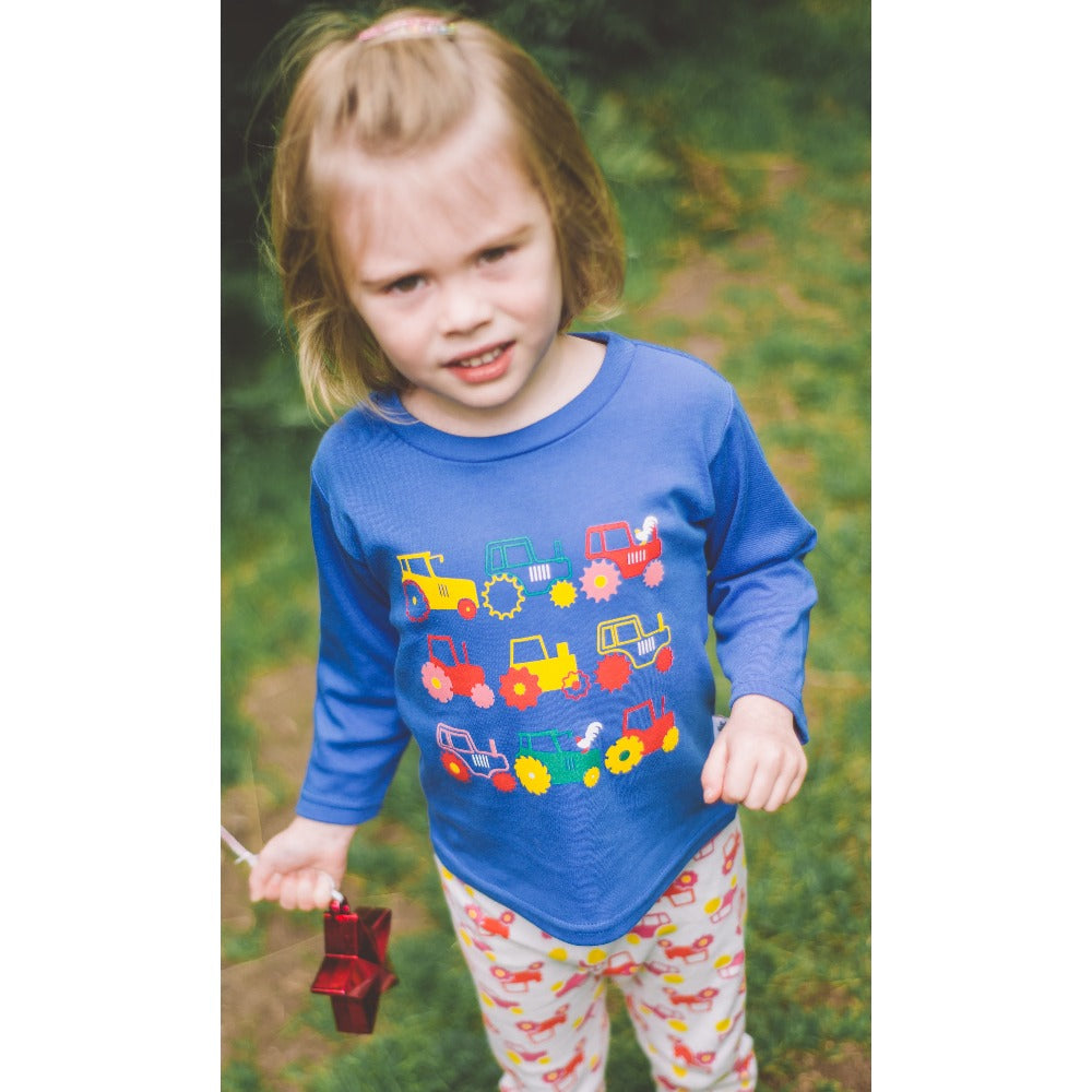 Little girl wearing Long Sleeved Tractor T-shirt by Toucan Blue | Cotswold Baby Co