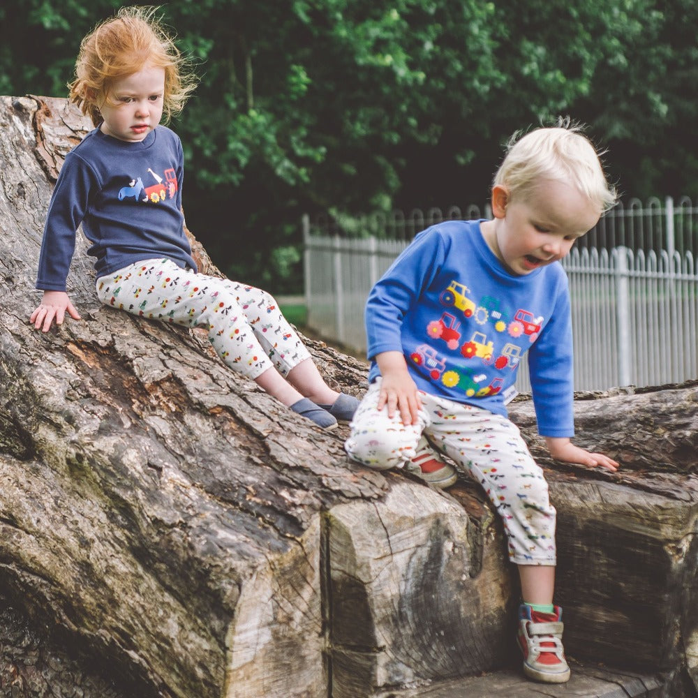 Little boy  wearing Long Sleeved Tractor T-shirt by Toucan Blue | Cotswold Baby Co