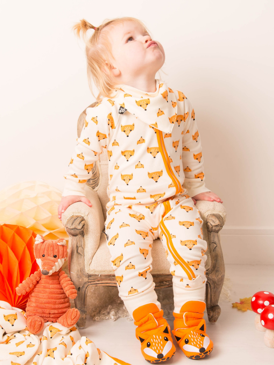 little girl in fox romper