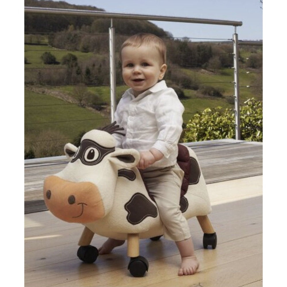 little boy riding Moobert cow toy by little bird told me | Cotswold Baby Co