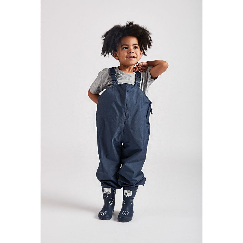 little boy wearing Navy stomper slacks by Grass & Air - Cotswold Baby Co