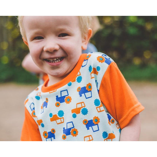 Little Boy wearing Orange & Aqua Tractor T-shirt by Toucan Blue | Cotswold Baby co