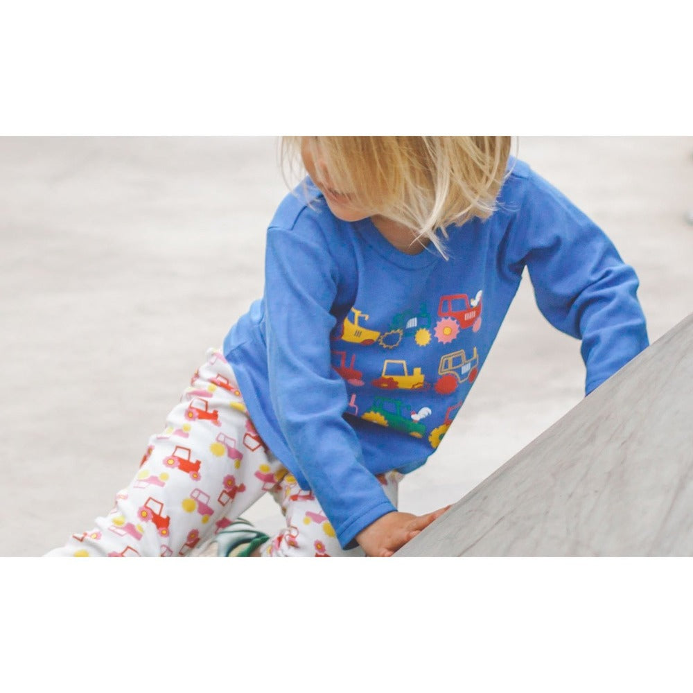Little girl wearing Long Sleeved Tractor T-shirt by Toucan Blue | Cotswold Baby Co